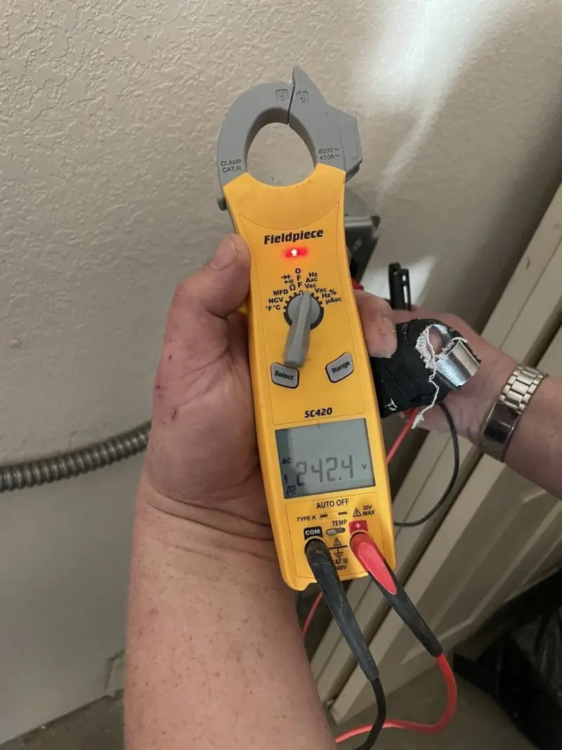 Voltage testing with clamp meter during Outlet Installation in Emerson